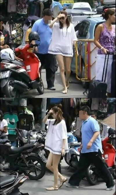 “下衣失踪”ファッションでタイの街頭に姿を見せた女優のハン・ヒョジュ（写真＝オンラインコミュニティー掲示板）。