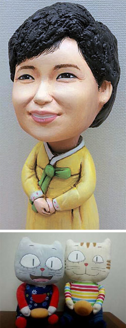 朴槿恵大統領が２７日に自身のツイッターに上げた写真２枚。上は江原創作開発センターがプレゼントした朴大統領の人形で、下は国産アニメーション「雲のパン」のキャラクター人形。