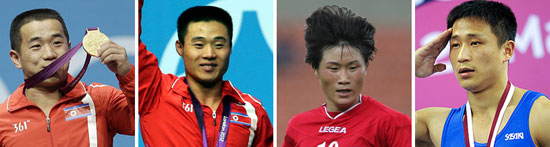 左から男子重量挙げのオム・ユンチョル（２０１２五輪５６キロ級金メダル）、キム・ウングク（２０１２五輪６２キロ級金メダル）、女子サッカーのナ・ウンシム（２０１０アジア競技大会銀メダル）、男子体操跳馬のリ・セグァン（２００６アジア競技大会金メダル）。