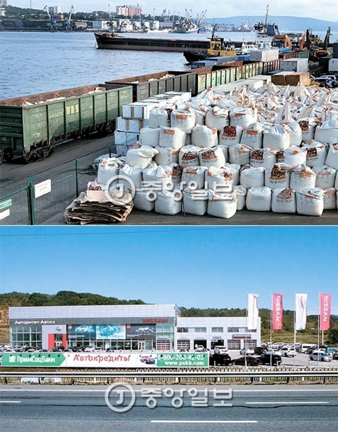 （写真上）ウラジオストク港に積まれている穀物。貨物列車の線路が港まで直接連結されている。（写真下）ウラジオストクの日本の日産車の代理店。ロシアで運行中の車両の２２％が日本車だ。韓国車は９％。