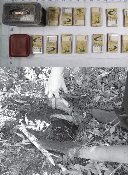 公務員の家の菜園に埋められたキムチ用保管容器に入っていた６５００万ウォン。（写真＝光州地検順天支庁）