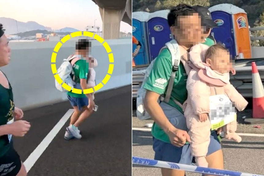   赤ちゃんを胸に抱いたまま走るマラソン参加者［写真 YouTube キャプチャー］